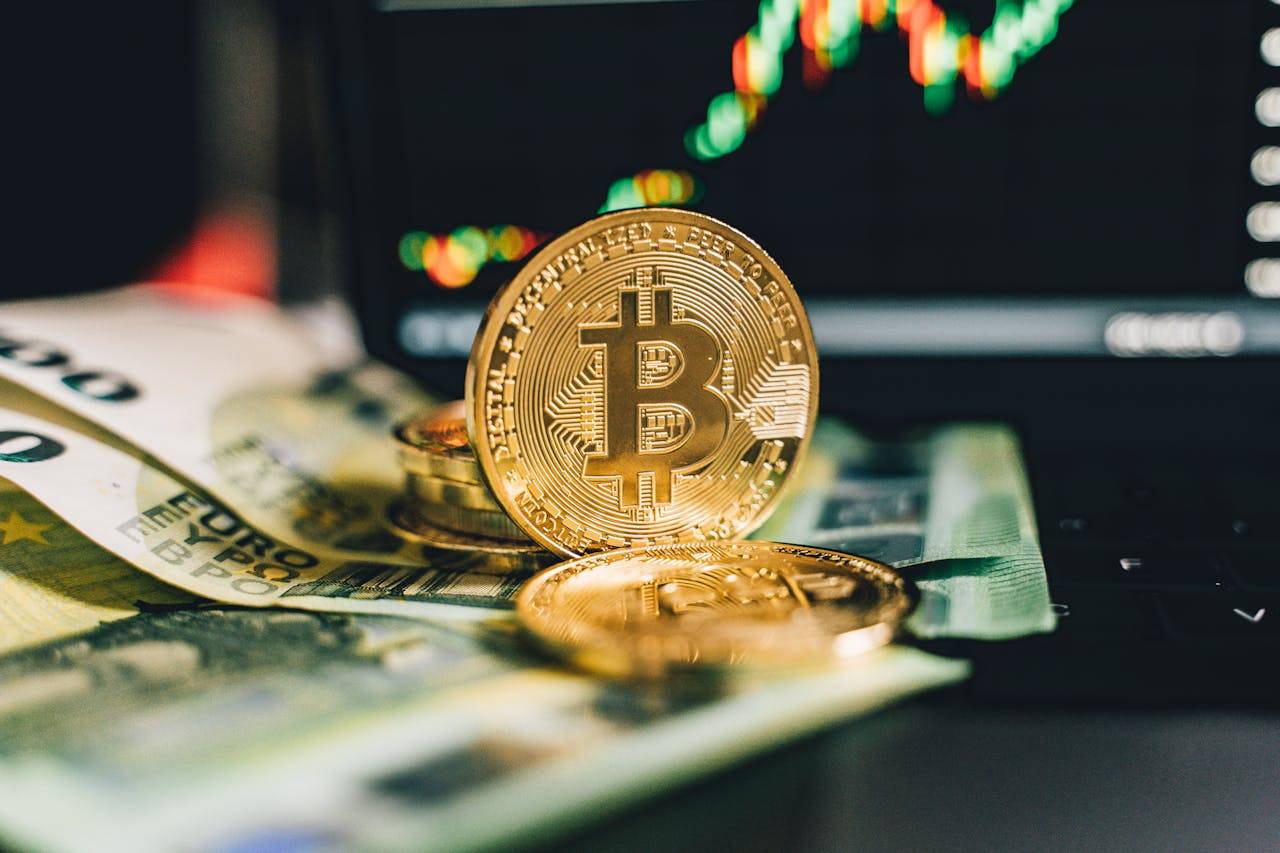 "Image of a laptop displaying a colorful bar graph with social media icons like Instagram, Facebook, and Twitter for crypto marketing."